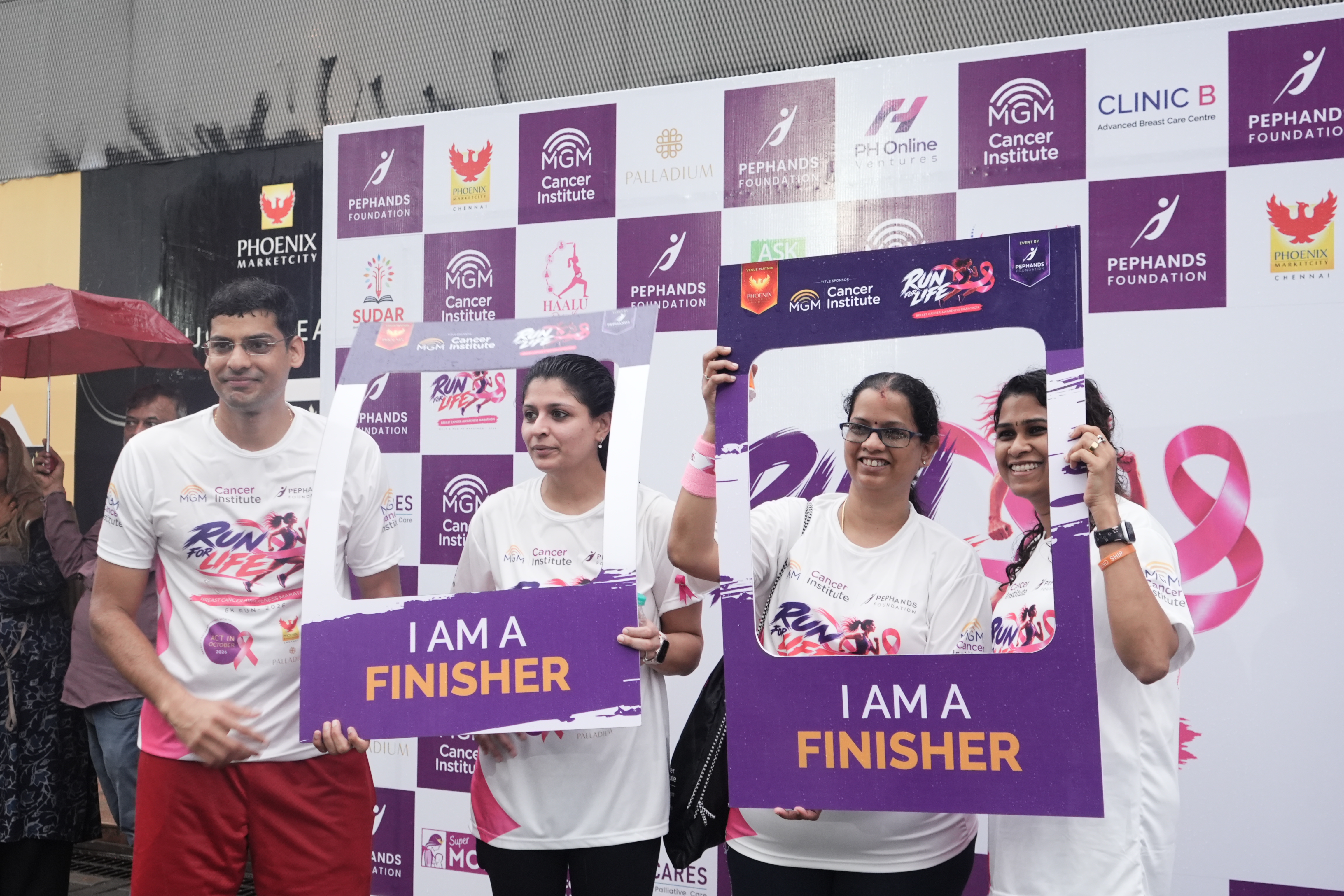 Joyful Runners Celebrating at I Am A Finisher Booth